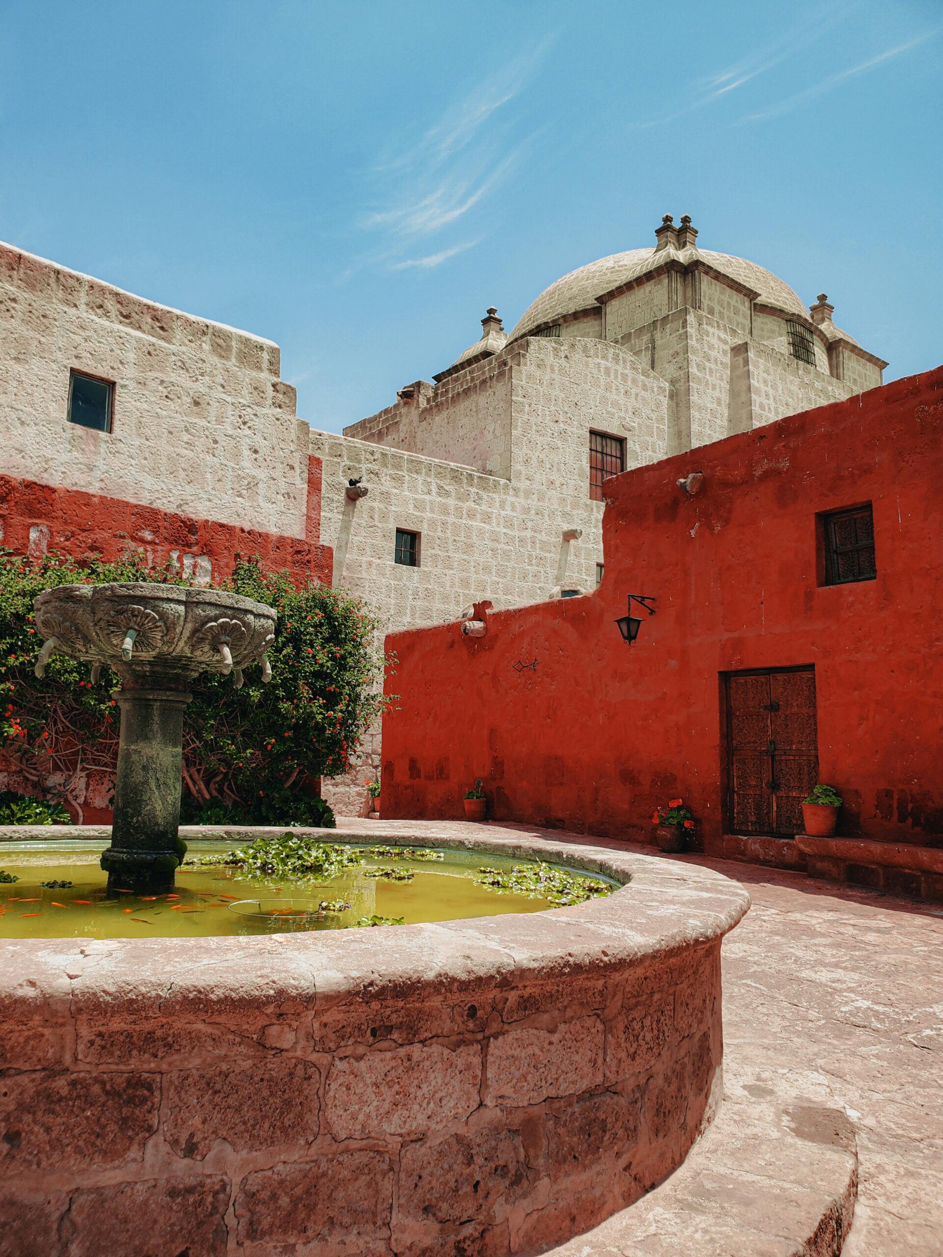 Stunning view of the Santa Catalina monastery courtyard with a historic fountain, Arequipa.